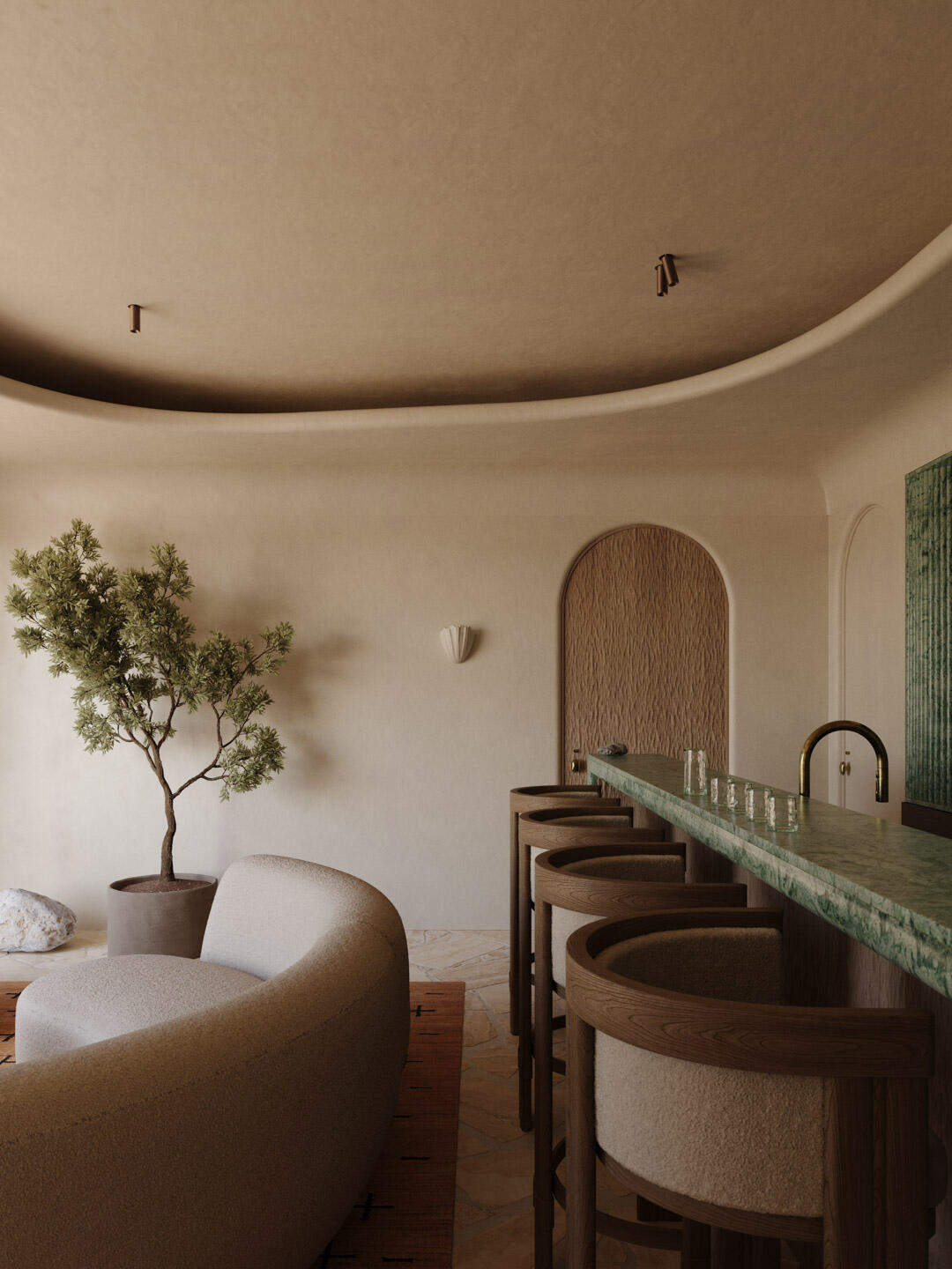 elegant interior featuring a curved boucle sofa, minimalist potted tree, and a green marble bar with four wooden bar stools, set against a softly textured wall with arched detailing and natural stone flooring in a warm, earthy palette.