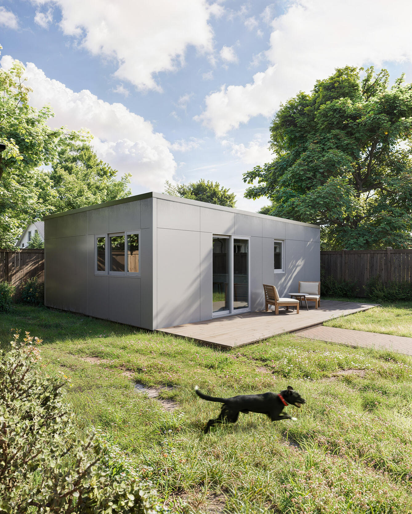 exterior archviz Rendering of a compact modern prefab home with outdoor seating on a wooden deck, set in a sunny backyard with a running dog.