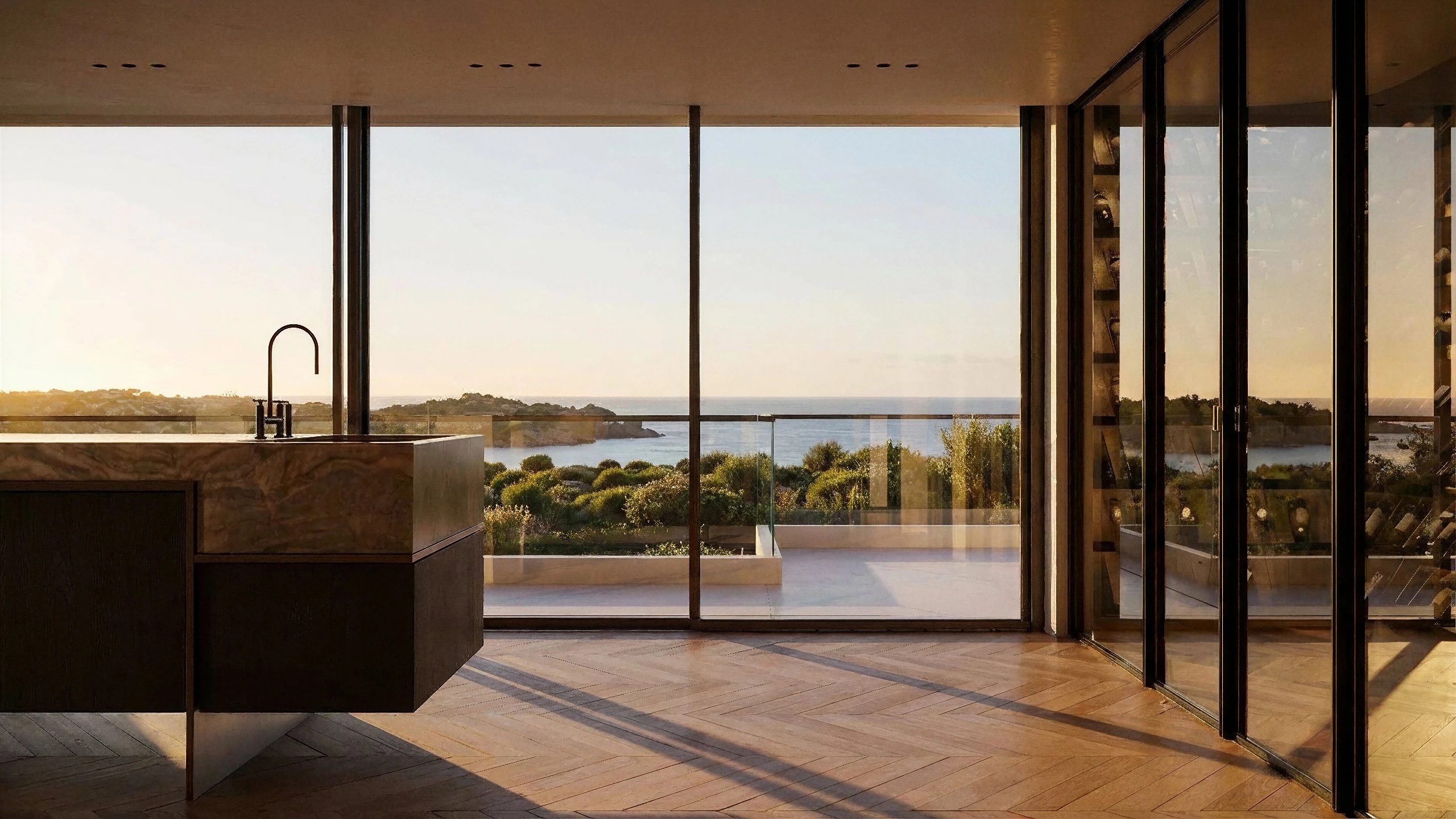 Open-plan kitchen with stone island overlooking Mediterranean coast at golden hour — architectural interior rendering